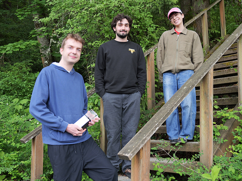 Student award winners in front of arboretum